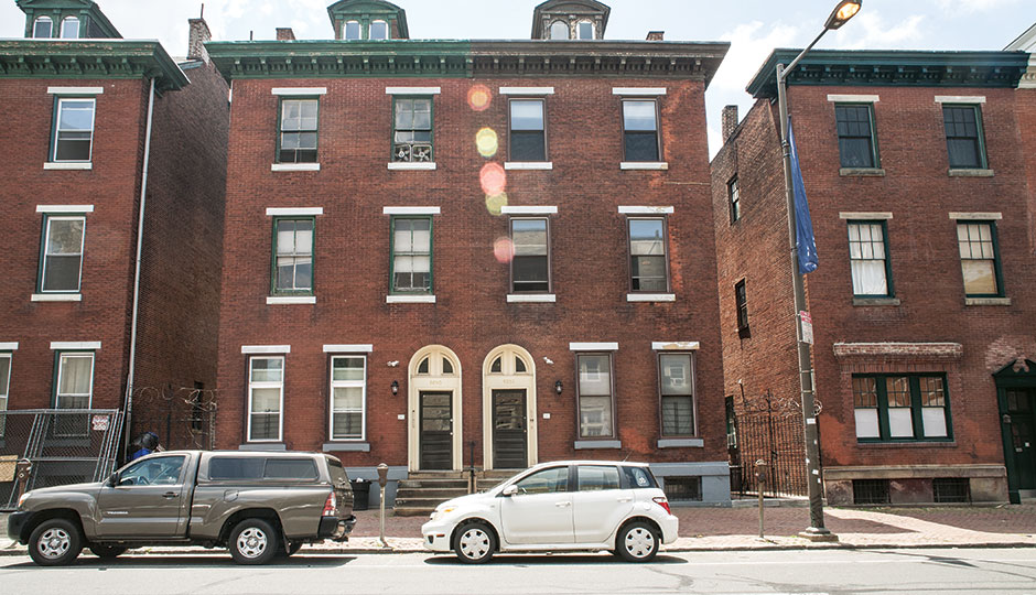 Rowhomes on Chestnut Street in West Philly. | Photograph by Claudia Gavin