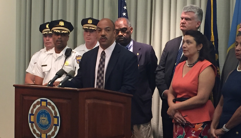 District Attorney Seth Williams (center) discusses a local auto theft and insurance fraud ring.