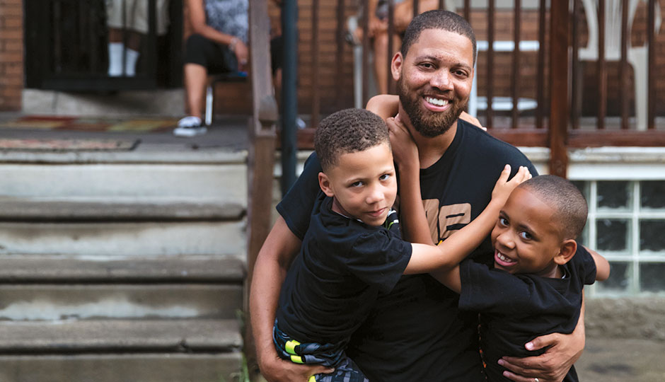 Otis Bullock Jr. with his sons Xavier, 5, and Malcolm, 8. | Photograph by Neal Santos
