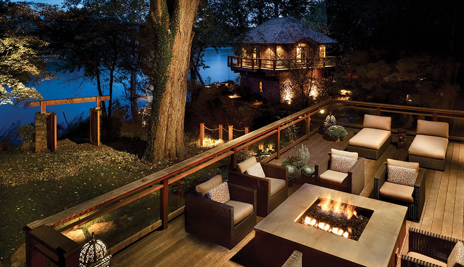 The deck disguises the elevated foundation while providing a woodsy perch for taking in views of the river.