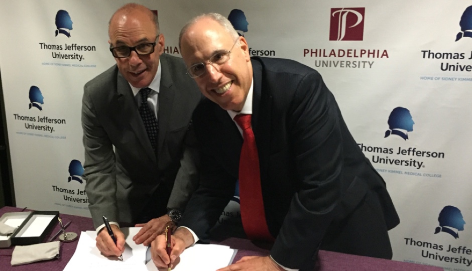 Dr. Stephen Klasko, President & CEO of Thomas Jefferson University and Jefferson Health, and Dr. Stephen Spinelli, PhilaU President, sign the binding combination agreement to bring the two institutions together as one, comprehensive university in 2017.
