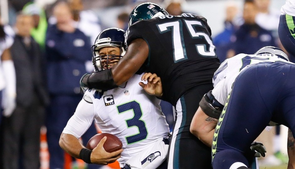 Russell Wilson and Vinny Curry. (USA Today Sports)