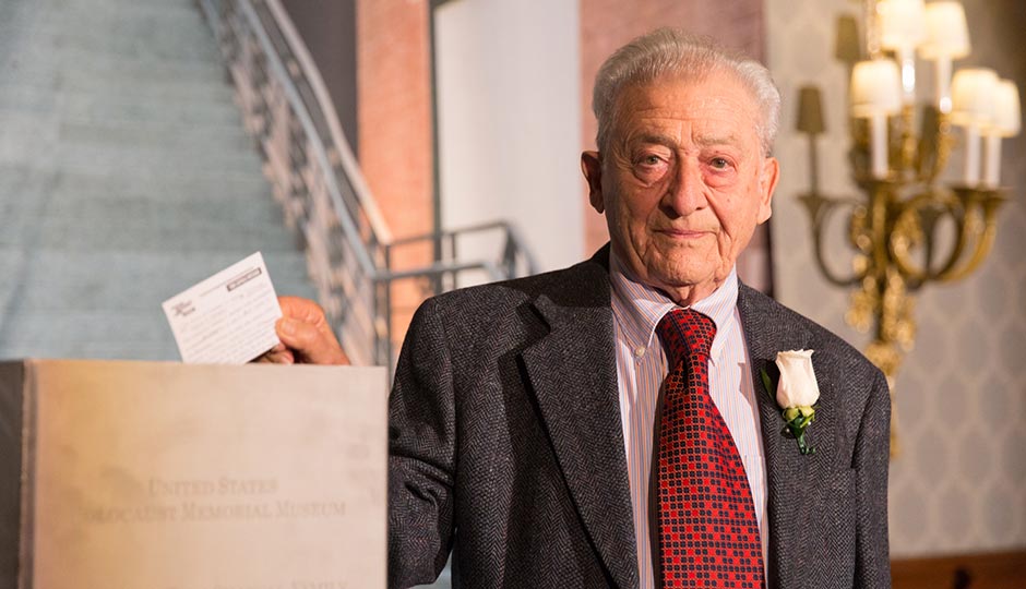 George Sakheim, a Philadelphia-area Holocaust survivor, places a message into a time capsule at the U.S. Holocaust Memorial Museum’s "What You Do Matters" dinner on Wednesday evening. Photo courtesy of the United States Holocaust Memorial Museum