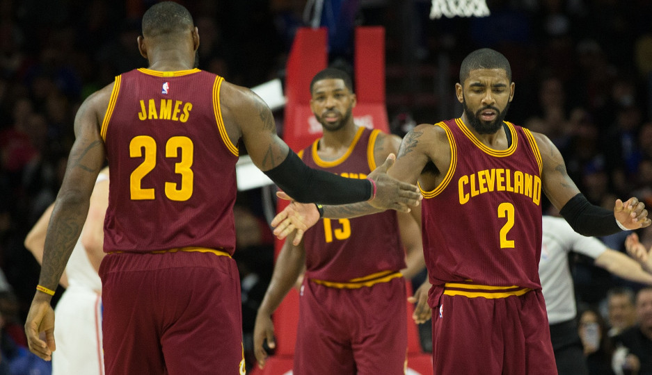 LeBron James (left) and Kyrie Irving (right) react after a basket in the second quarter of Cleveland's 112-108 victory | Bill Streicher-USA TODAY Sports