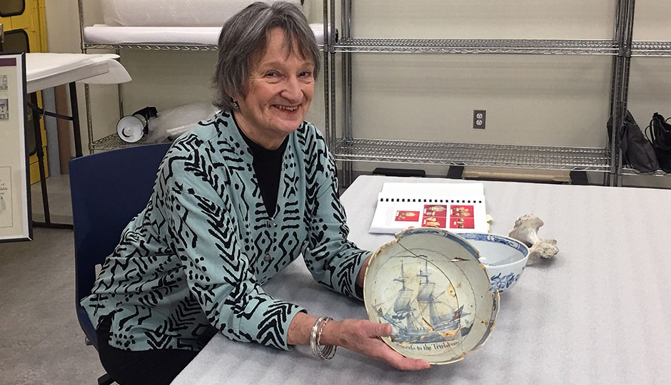 Rebecca Yamin displays blue and white bowl from the 1760s