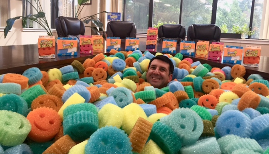 Aaron Krause in a sea of Scrub Daddy sponges. Image courtesy of Scrub Daddy. 
