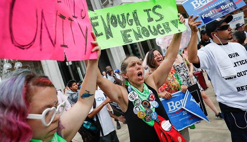 Bernie Sanders supporters protest at City Hall during the DNC on July 28, 2016. Photo: John Minchillo/AP
