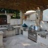 A fabulous outdoor kitchen sets the grillmasters apart from the weekend cooks.