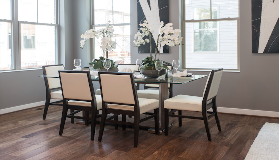 A staged dining room in a completed unit.