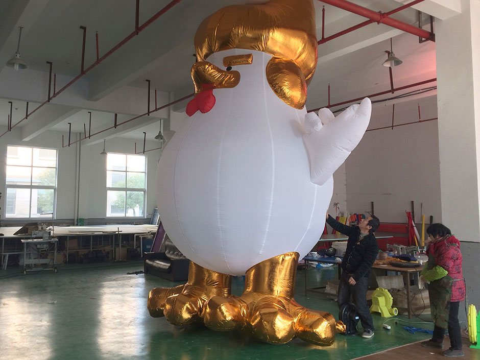 a giant inflatable rooster that looks like Donald Trump