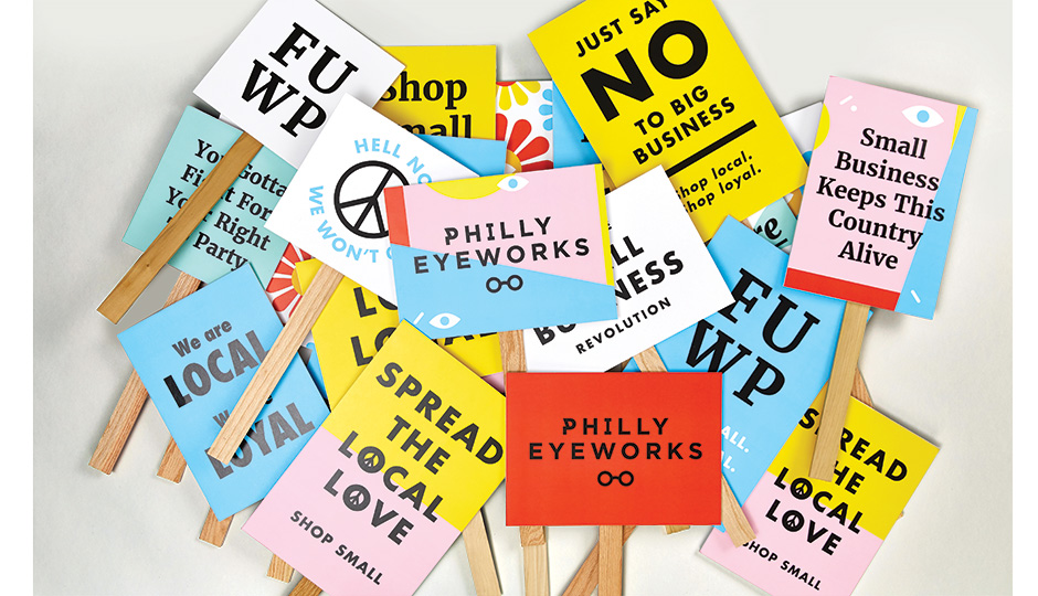Philly EyeWorks airs its grievances with groovy picket signs. Photo by Andrew Bonacci.