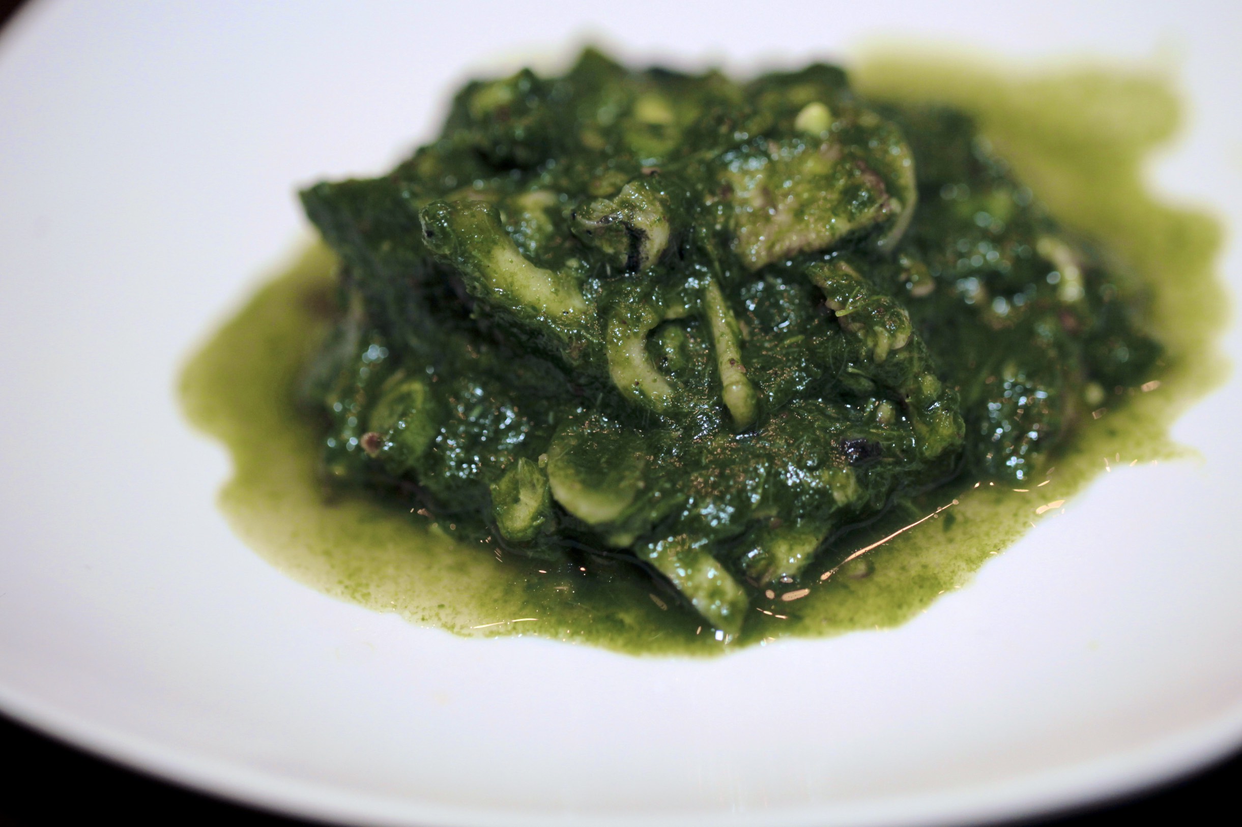 Laab taow: "spinach" with river snails