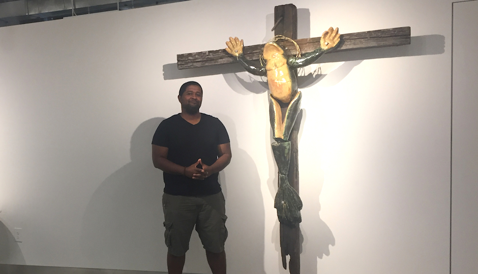 Artist Ashaundei Smith and his crucified frog sculpture at Penn State Abington, where the artwork is the talk of the campus.