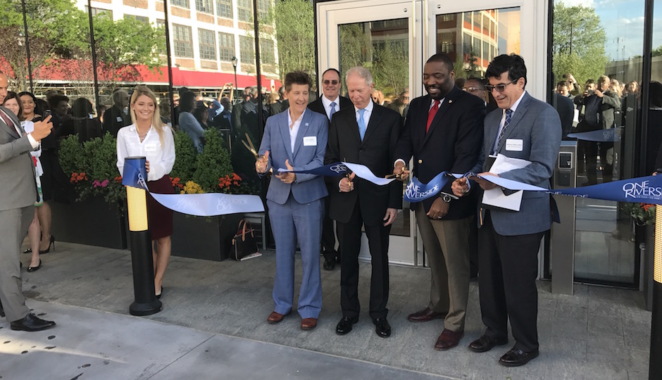 (Left to right) Planning and Development Director Anne Fadullon, Carl Dranoff, City Council member Kenyatta Johnson (D-2nd District) and Managing Director Mike DeBerardinis cut the ribbon to mark the official opening of One Riverside May 2nd. | Photo: Sandy Smith