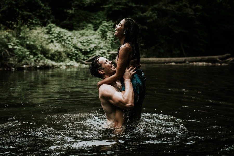 couple in river engagement photo