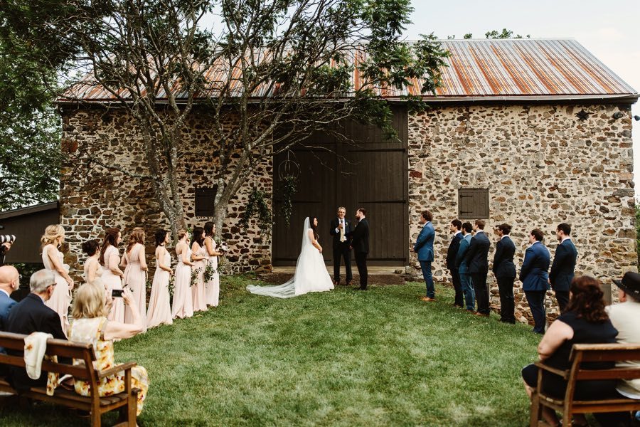 outdoor wedding ceremony at a barn