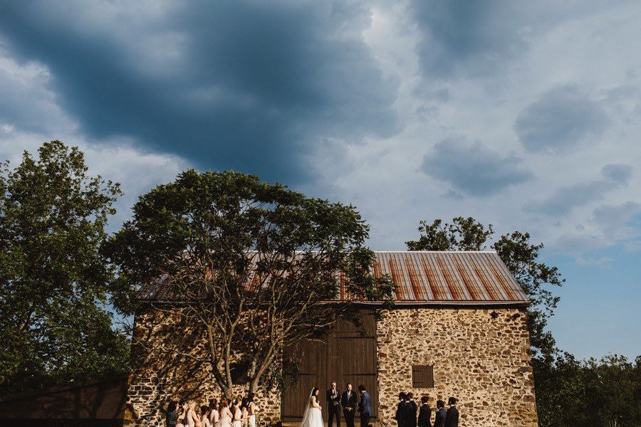 outdoor wedding ceremony at a barn