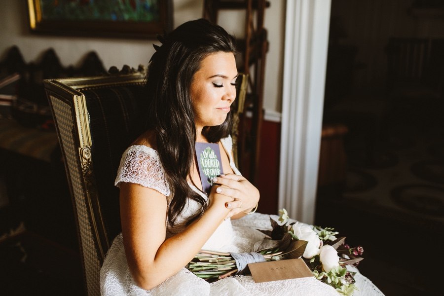 bride reading card from groom