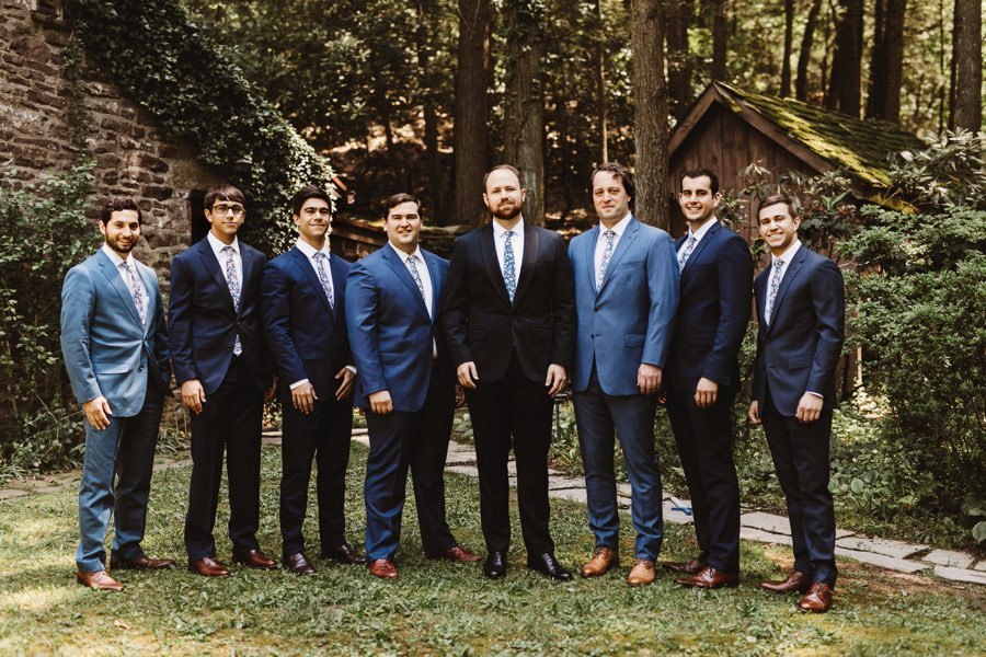 groomsmen in navy suits