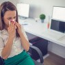 woman blowing nose