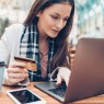 Elegant woman with credit card and laptop
