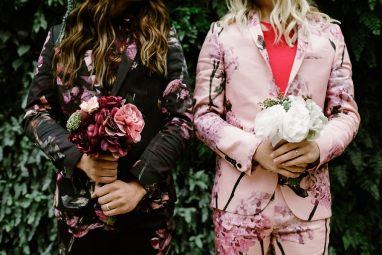 Longwood Gardens Engagement Photos Featuring Bold Flower Suits
