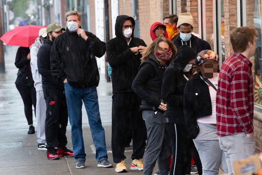 shoppers not social distancing in the italian market in philadelphia during the coronavirus outbreak