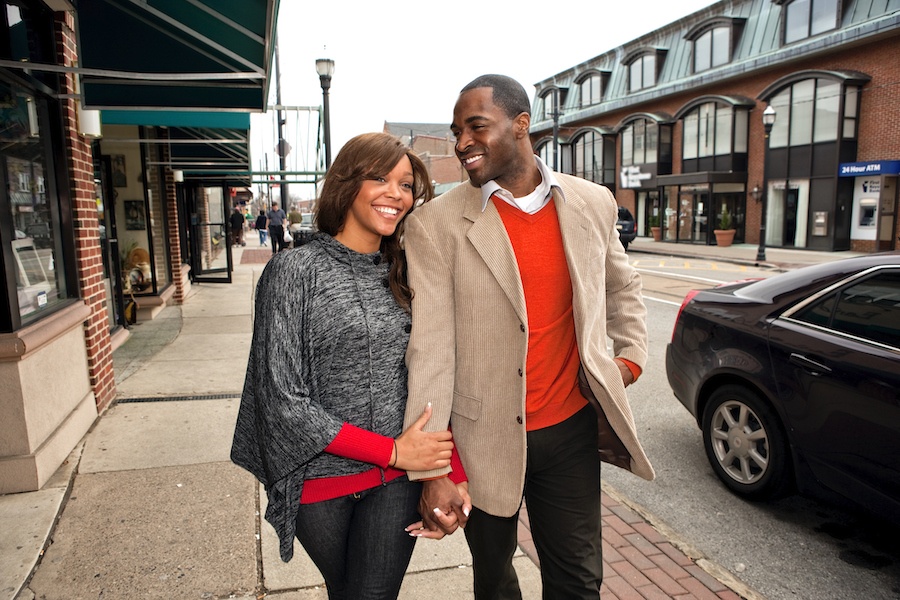 suburban jungle couple walking along suburban street