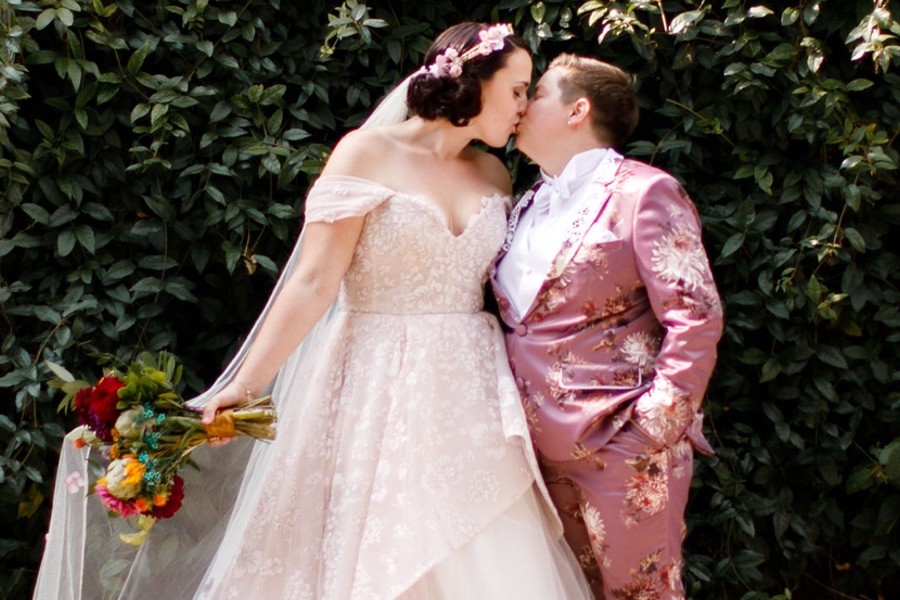 Bride in a pink wedding tuxedo