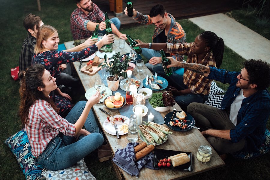 friends enjoying an outdoor thanksgiving, which you can't really do in Philadelphia thanks to new COVID restriction 