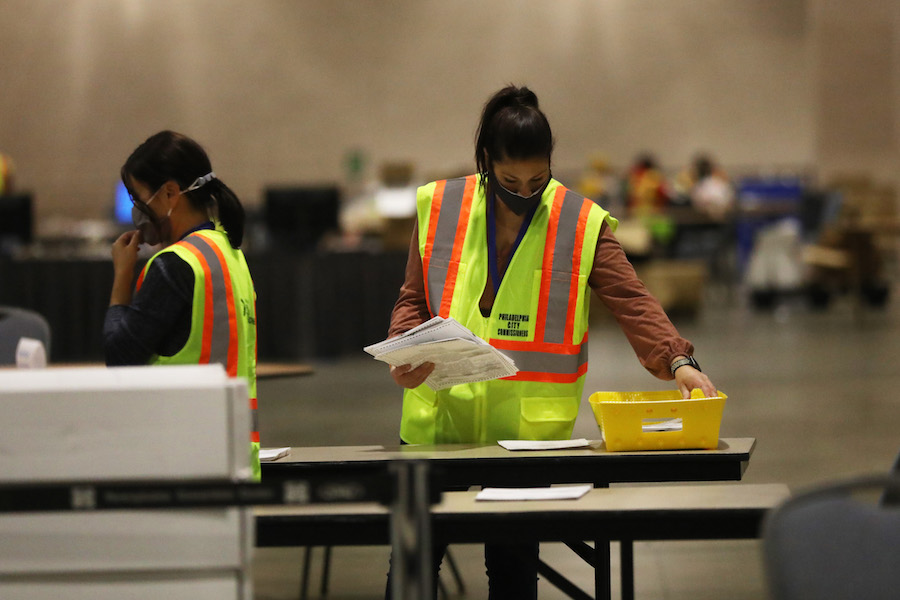 workers count the Philadelphia vote inside the Pennsylvania Convention Center, which will play a big part in the Pennsylvania election results