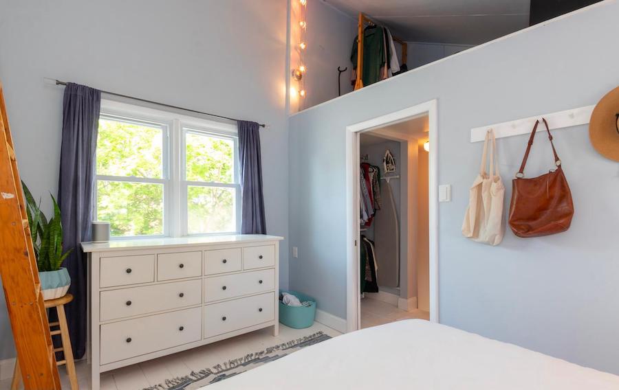 primary bedroom showing storage loft