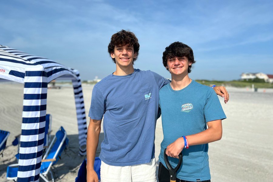 perfect beach day nj founders Jude Vaughan and Samuel Abella setting up some jersey shore chair rentals in Brigantine