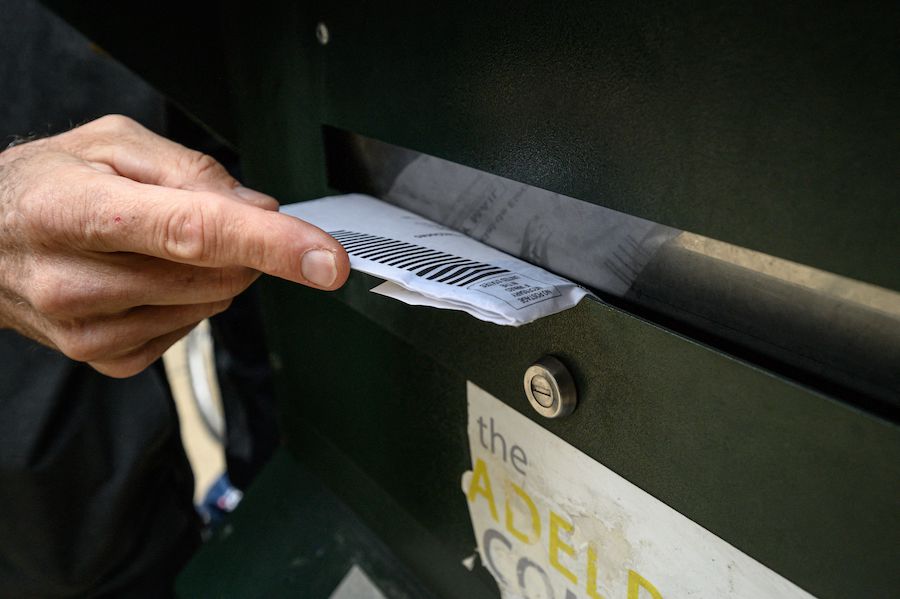 someone mailing their mail-in ballot in Philadelphia, Pennsylvania