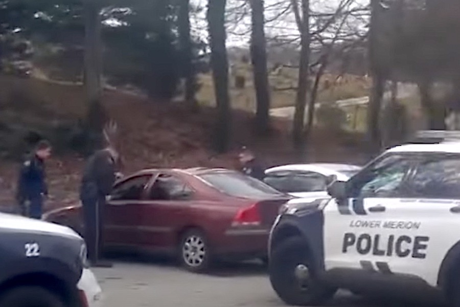 a video still showing lower merion police confronting a black woman in a wawa parking lot just before they tased her