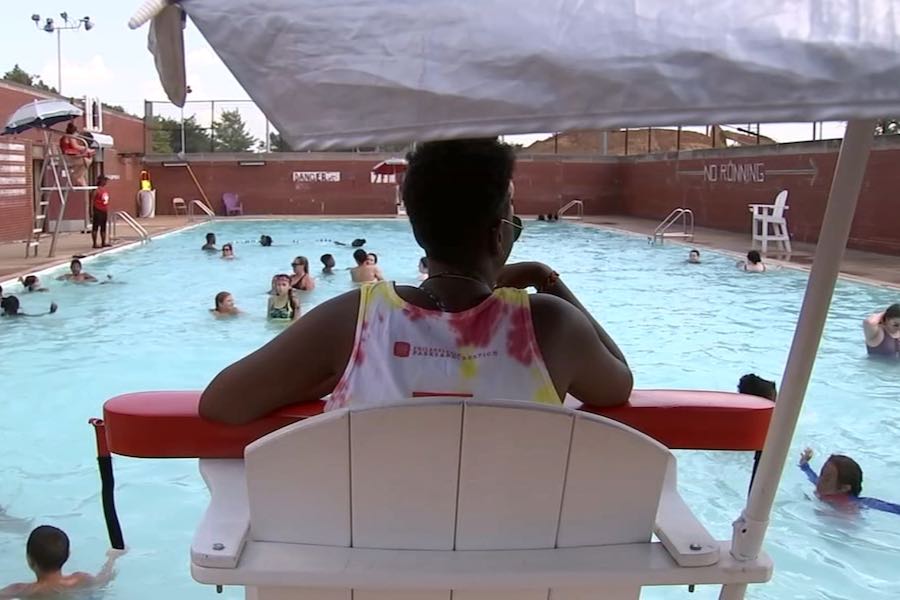a philadelphia lifeguard watches over a public pool in philadelphia