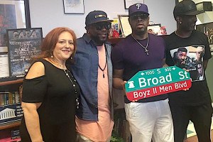 CAPA principal Joanne Beaver poses with Boyz II Men in 2017 (photo via School District of Philadelphia)