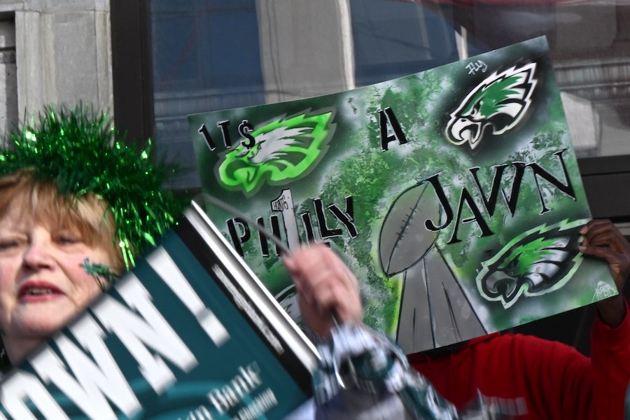 Eagles fans with posters using the word jawn, which was just added to the dictionary along with a jawn definition