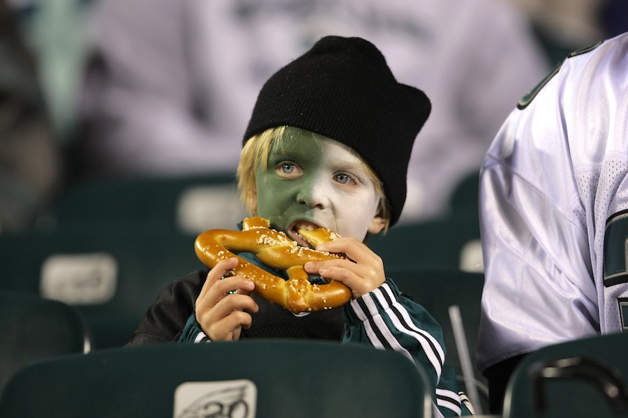 A Philadelphia Eagles fan enjoying a soft pretzel in Philadelphia, where two soft pretzel companies are about to go at it in court
