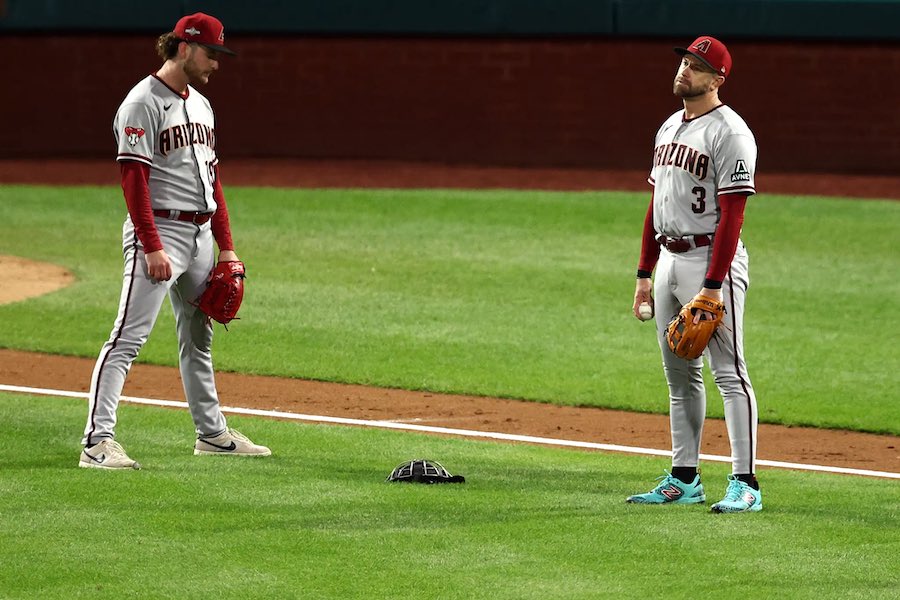 diamondbacks players react to a major error in Game 2 with the Phillies