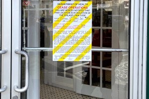 The Philadelphia Department of Health put this cease operations sign on the door of Famous 4th Street Deli after a restaurant inspection on Thursday revealed some major problems