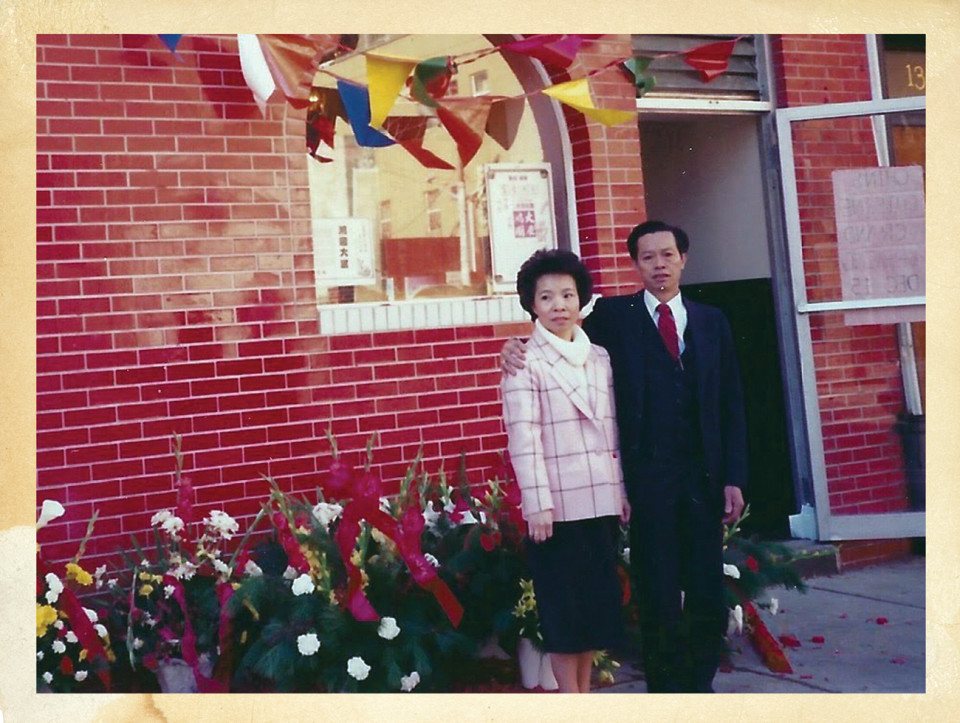 john chin's parents in front of their restaurant in the Chinatown section of Philadelphia