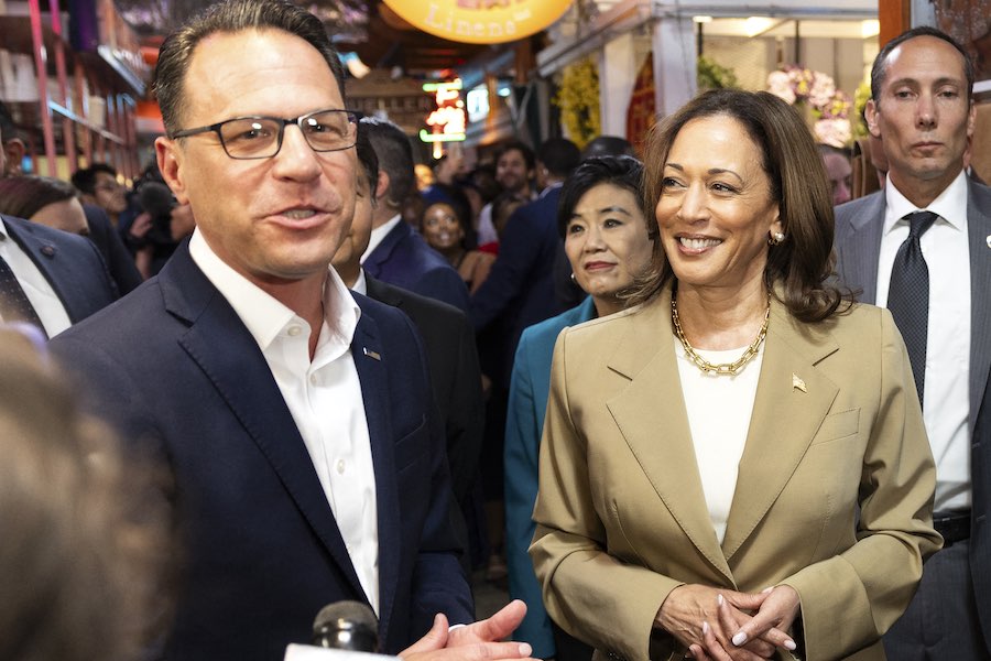 Vice President Kamala Harris and Pennsylvania Governor Josh Shapiro (L) speak to the press while making a stop at the Reading Terminal Market in Philadelphia, Pennsylvania, July 13, 2024. (Photo by RYAN COLLERD / AFP)