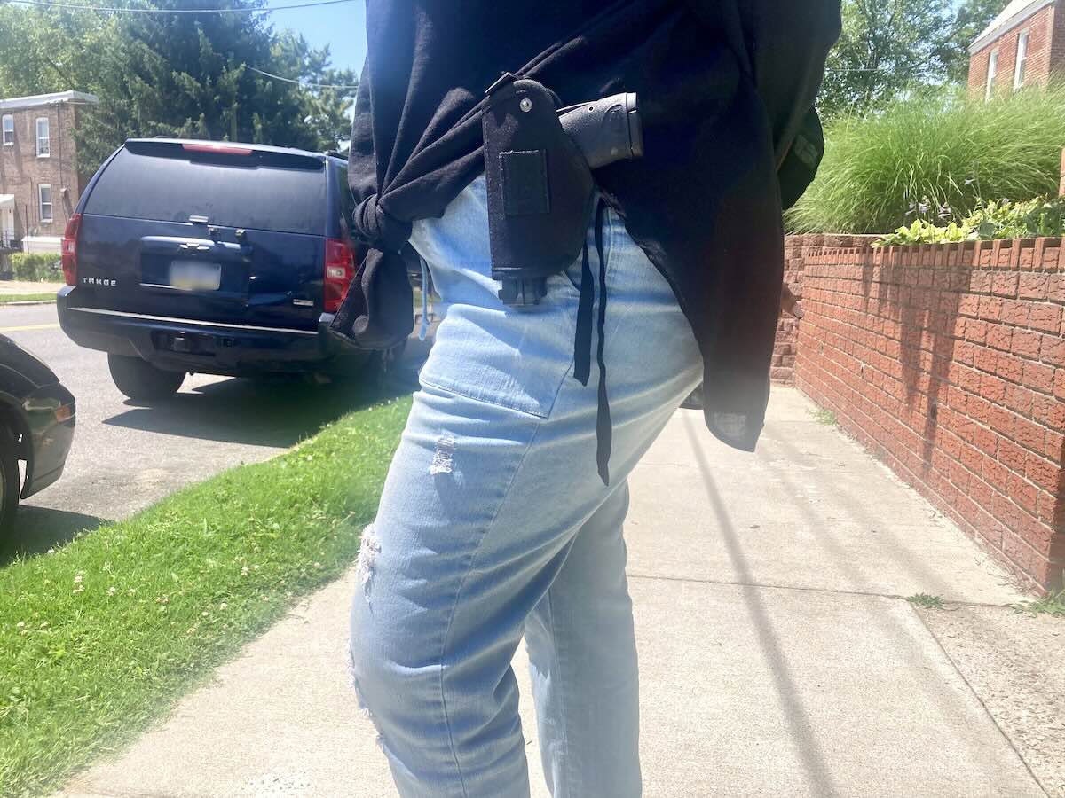 A woman open-carrying her gun on a West Philadelphia sidewalk, two days after the Superior Court of Pennsylvania ruled that the open-carry ban in Philadelphia is unconstitutional.
