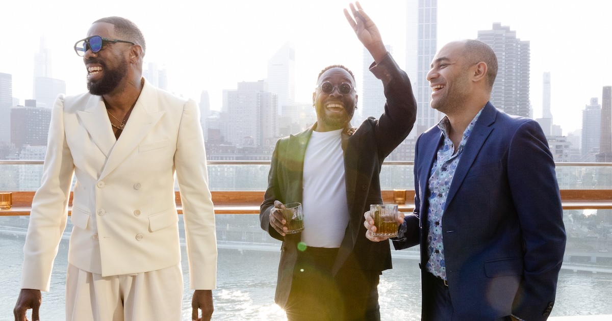 James Ijames (center) at a pre-Tonys party hosted by Colman Domingo (left)