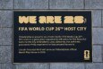 A plaque outside of Lincoln Financial Field, declaring that Philadelphia will be a host city for the FIFA World Cup 2026, a fact that has some wondering if Philadelphia restaurants should add auto-gratuity to all checks