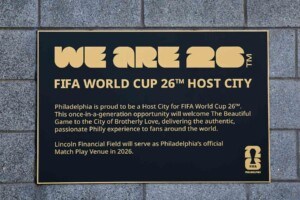 A plaque outside of Lincoln Financial Field, declaring that Philadelphia will be a host city for the FIFA World Cup 2026, a fact that has some wondering if Philadelphia restaurants should add auto-gratuity to all checks